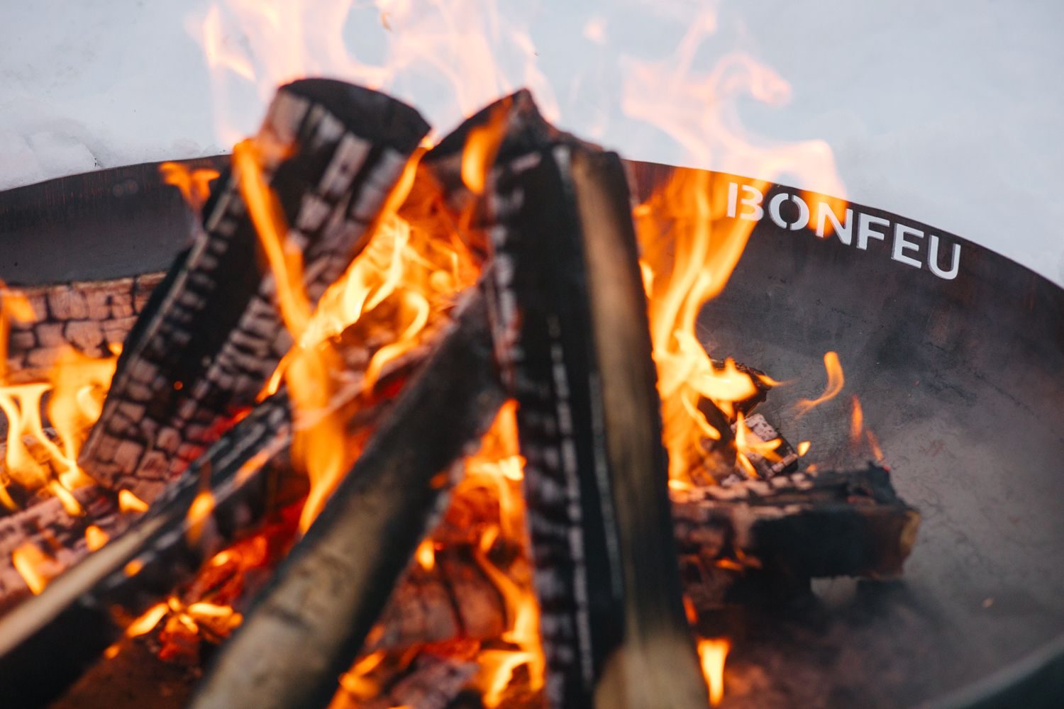 Flames rising from the outdoor fire bowl, ready for the evening's storytelling.