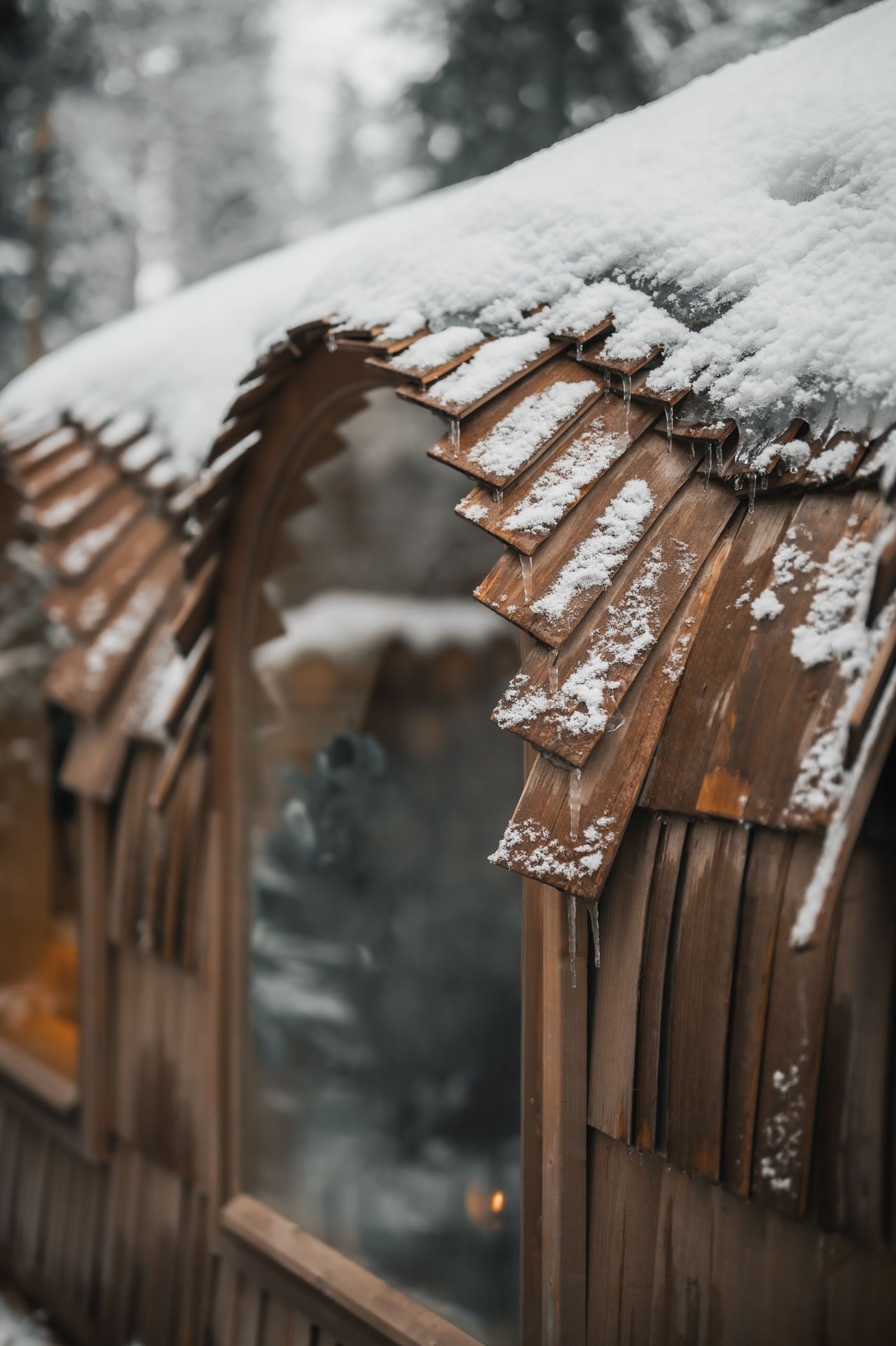 A frosted cabin window framing the glowing interior view.